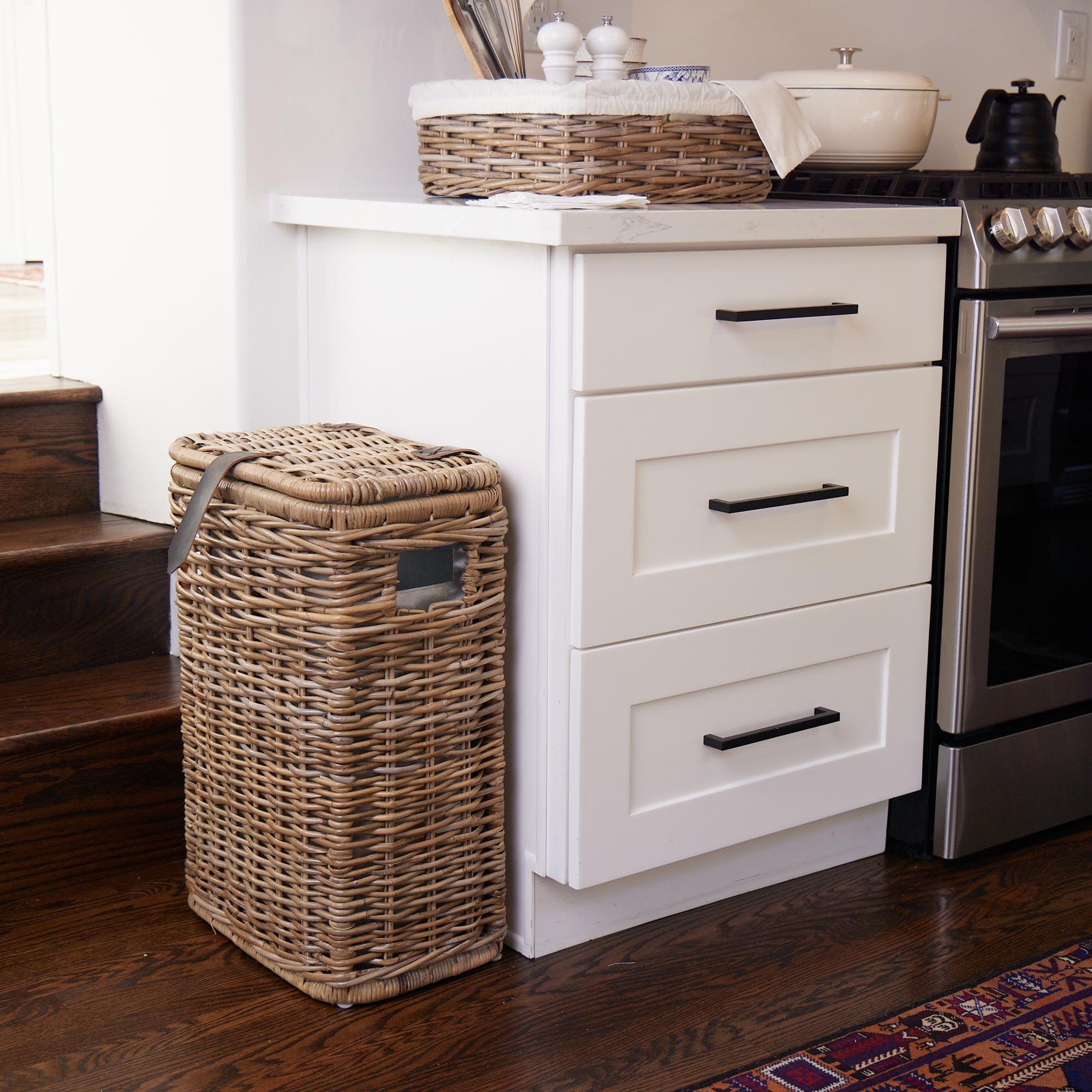 Kubu Wicker Rectangular Kitchen Trash Basket with Metal Liner in Serene Grey shown in kitchen | The Basket Lady