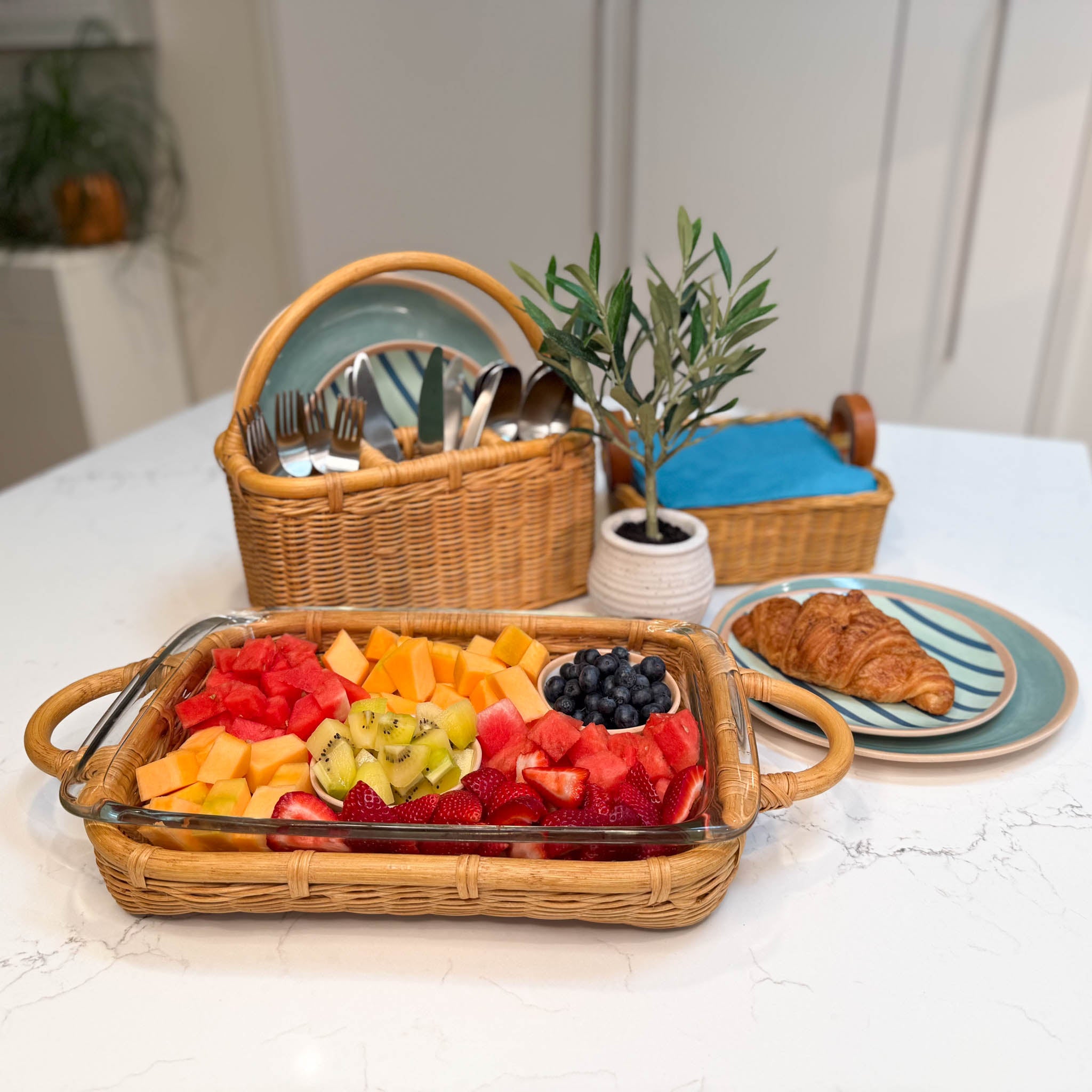 Wicker Serving Basket Collection in Sandstone, includes wicker casserole basket, wicker napkin basket and wicker utensil caddy. 