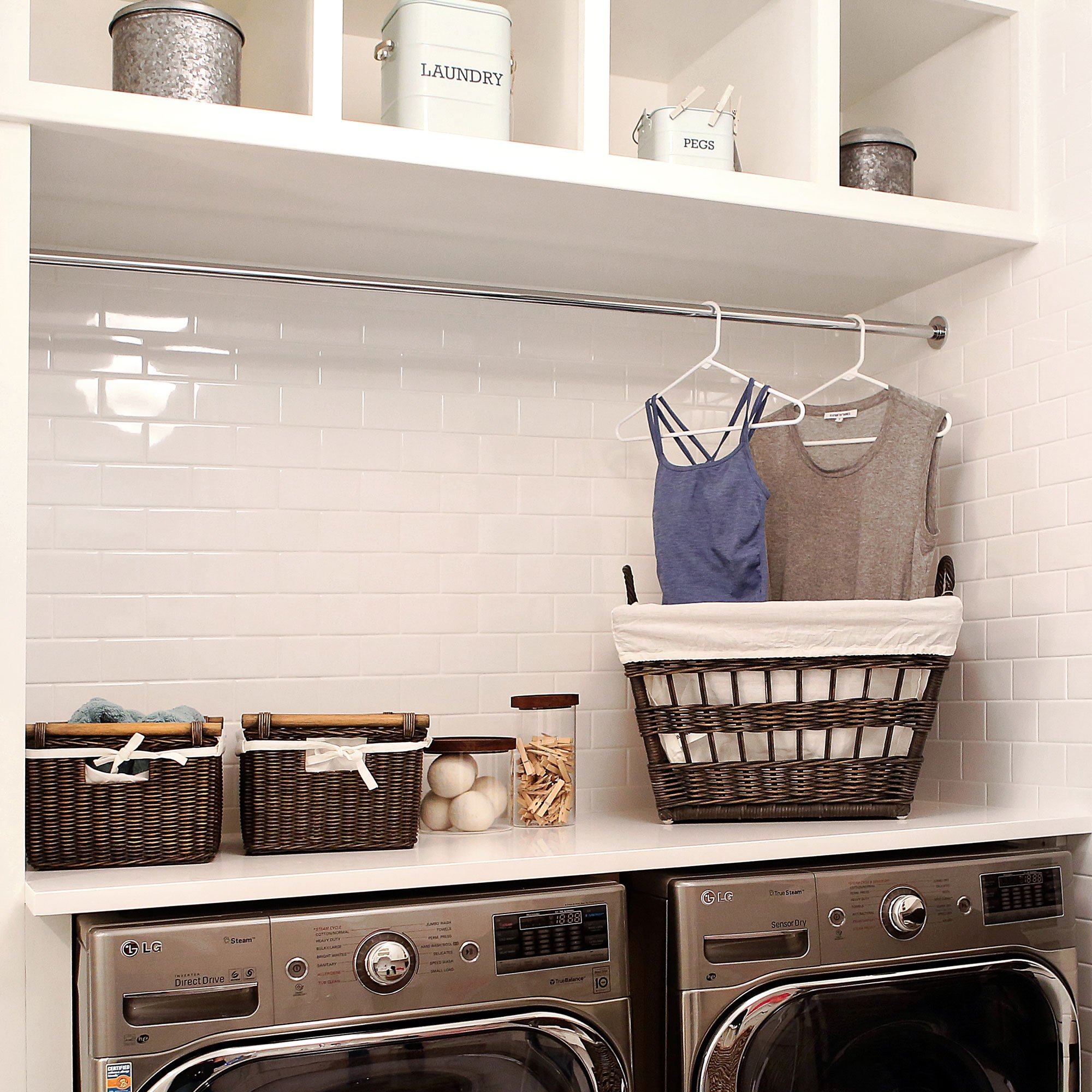 French Wicker Laundry Basket and Pole Handle Wicker Storage Baskets in Antique Walnut Brown in Laundry Room