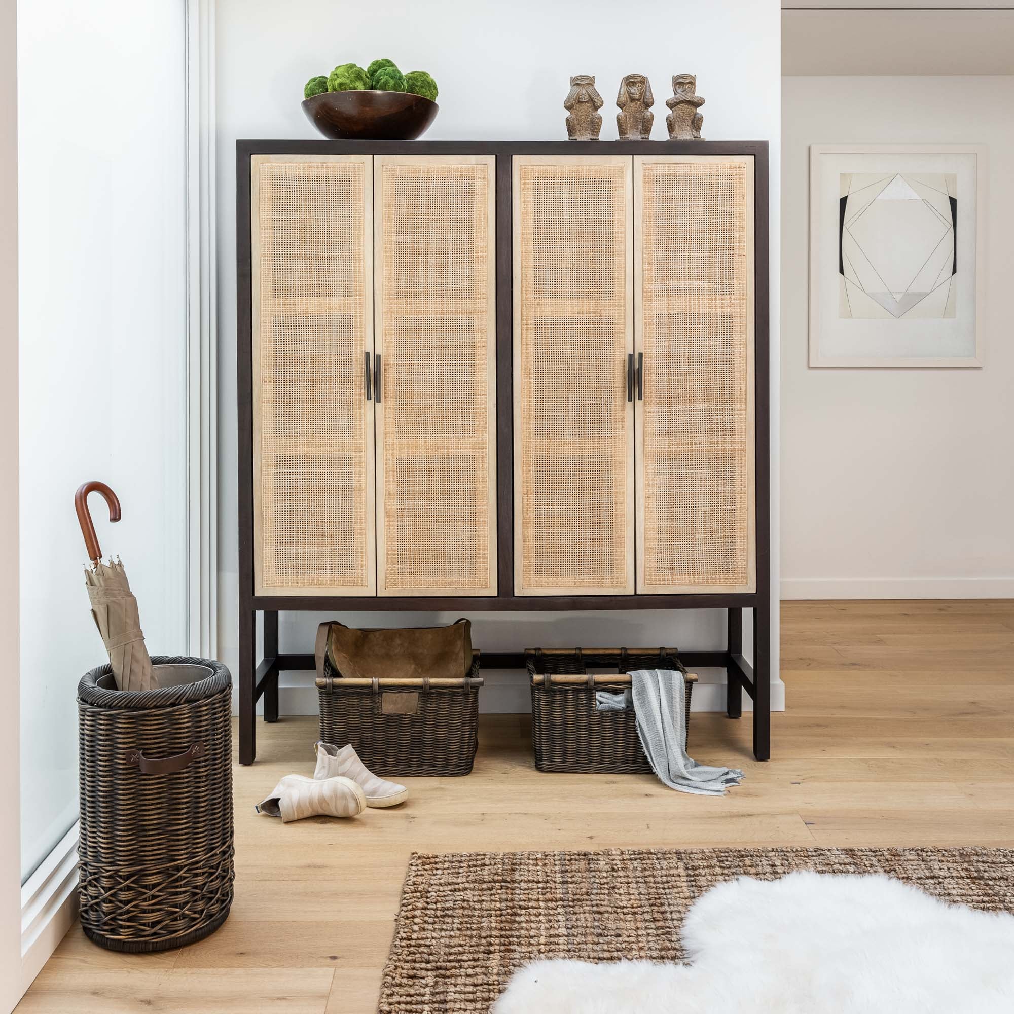 Tall Narrow Wicker Storage Baskets in Antique Walnut Brown in entryway | The Basket Lady
