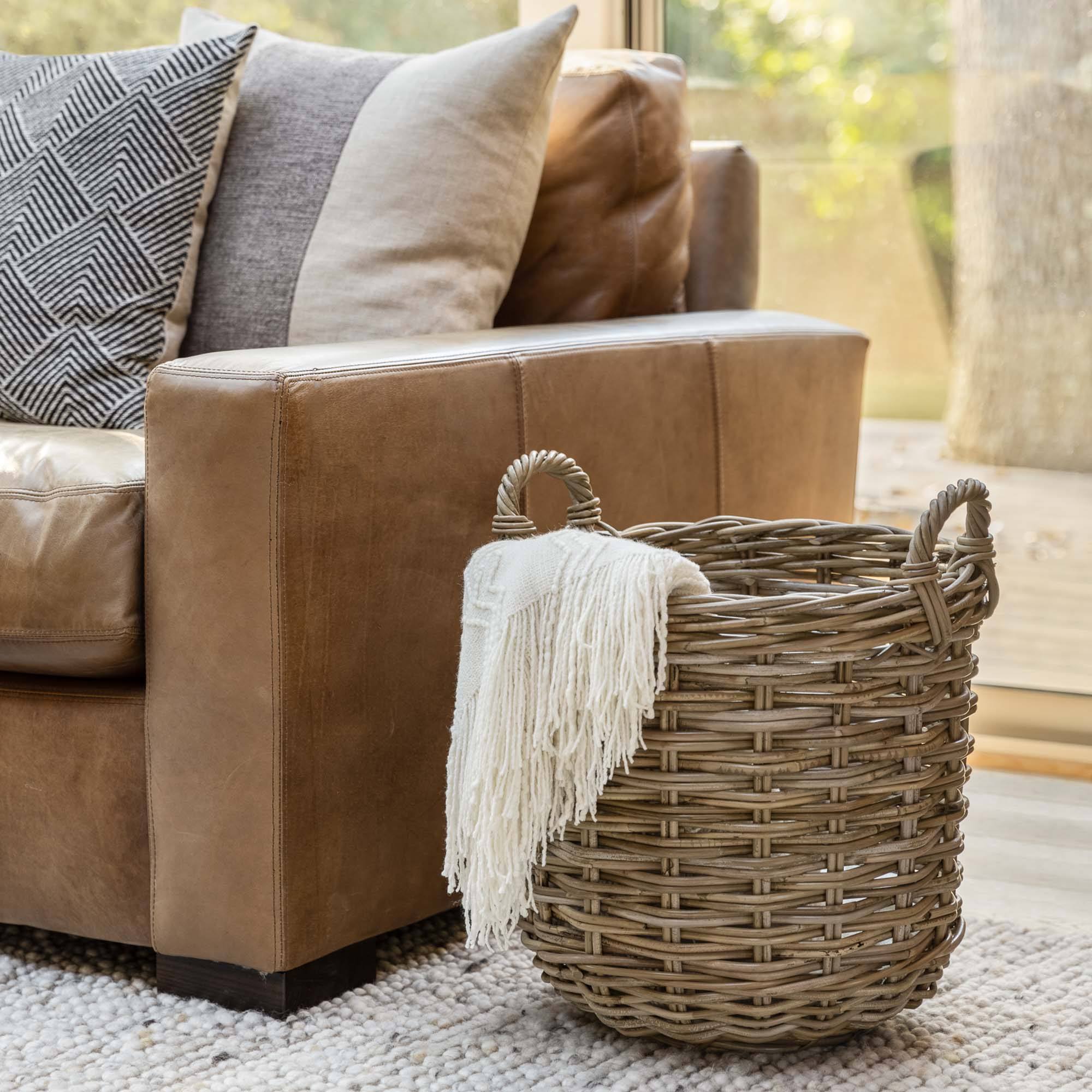 Store blankets where you need them in your living room with the Kubu Round Storage Tote Basket | The Basket Lady